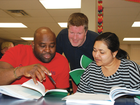 WHSC instructor helps small group of participants in JHSC Certification Part 1 training class